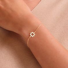 Adding a ray of sunshine to your ensemble with our 14k Solid Gold Open Sun Bracelet! You can shine all day and all night. Yes, particularly at night. D E T A I L S * Made to Order. * 100% 14k Solid Gold * Choice of Gold Color: Yellow Gold, Rose Gold, White Gold * Charm height: 13 mm/0.5 inch * Charm width: 11 mm/0.4 inch * Chain length is adjustable from 6 to 7 inches. * Ready to Ship in 1-3 Business Days * 100% US sourced * 2 Years Warranty * Free Express International Shipping * Free returns w Chain Bracelet Designs Gold For Women, Sun Bracelet, Gold Celestial Bracelet For Gift, Gold Sun Bracelet, Celestial Gold Bracelet, Sun Charm Bracelet, Elegant Yellow Gold Star Bracelet, Gold Jewelry Prom, Dainty Gold Bracelet