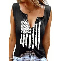 a woman wearing a black shirt with an american flag on the chest and ripped shorts