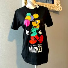 Size Small Mickey Mouse Shirt From The Disney Parks. Black Disney T-shirt For Disney Trips, Fun Mickey Mouse Shirt For Disney Trips, Black Minnie Mouse T-shirt Short Sleeve, Black Minnie Mouse Short Sleeve T-shirt, Black T-shirt With Minnie Mouse Graphic, Crew Neck, Black Mickey Mouse Tops For Disney Events, Black Mickey Mouse Top For Disney Fan Events, Black Disney T-shirt For Fan Events, Fun Mickey Mouse Tops For Disney Fan Events