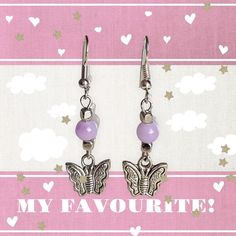 Silver colored Butterfly charm drop earrings. With up-cycled /repurposed lavender colored beads. Nickel-free Lavender Drop Earrings, Lavender Dangle Earrings Nickel Free, Lavender Nickel Free Dangle Earrings, Lavender Nickel-free Dangle Earrings, Lavender Hypoallergenic Drop Earrings, Lavender Dangle Earrings Hypoallergenic, Lavender Hypoallergenic Dangle Earrings, Colored Butterfly, Butterfly Charm