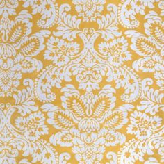 a yellow and white wallpaper with an ornate design