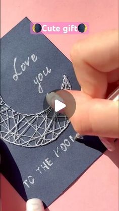 someone is holding a card with the words love you to the moon on it and an eiffel tower