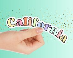 someone is holding the word california in their hand