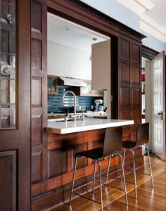 an image of a kitchen setting with bar stools