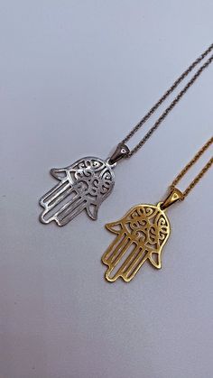 Introducing "The Miriam" our beautiful Hamsa hand/ Hand of Fatima/ Hand of Miriam pendant necklace. Traditional to the Middle East and North Africa,  this beautiful ancient symbol has origins in Islam, Judaism and Christianity. It is a symbol of protection, warding off evil and keeping you safe.  Downward Facing: this symbolises abundance and prosperity, inviting good things to come into your life. Upside down Hamsa hand is also seen as a blessing for fertility and as a means for receiving answe Symbolic Etched Jewelry For Blessing, Symbolic Pendant Necklace With Intricate Design, Symbolic Necklaces With Intricate Design, Symbolic Intricate Design Necklace For Gift, Spiritual Etched Metal Necklace, Etched Pendant Necklace For Blessing, Necklace Traditional, Fatima Hand, Claw Necklace