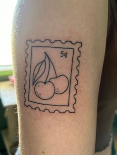 a stamp with some cherries on it and the number 54 is in black ink