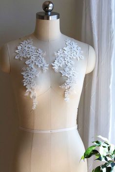 Ivory Lace Applique, Lace Applique for Wedding Dress Shoulder, Mirrored Pair Bridal Lace Applique, Bridal Veil Lace Applique, Embroider Color: Ivory Features: For bridal dress shoulder Mirrored Pair Fully embroidered lace applique Great for making wedding dresses/bridal gowns shoulders, bridal veils, garters and other designs. Similar Items: https://www.etsy.com/listing/816863615/2109-wedding-dress-lace-applique?ref=shop_home_active_49 Store Link: https://www.etsy.com/shop/FindingBridalLace Ship Cream Lace With Appliques For Wedding, Fitted White Lace For Wedding Night, White Lace Patchwork Wedding Dress, White Fitted Lace For Bride, Fitted White Lace For Bride, Fitted White Bridal Lace, White Lace Bridal Accessories For Wedding, White Lace Wedding Dress For Bride, Bridal Dresses Lace