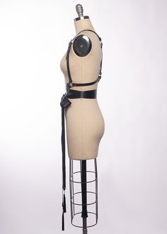 High quality, durable-yet-delicate bespoke harness made in leather or vegan leather. Embellished with tassels. Luxurious wide satin ribbons wrap around the waist and tie into a bow. Choose from gold or silver toned nickel plated steel hardware. Shown in black leather/gold ribbon/gold hardware and black leather/black ribbon/silver hardware. Custom sizing available. All pieces are MADE TO ORDER, standard sizes XS-4XL. If your measurements fall outside these standards or you are unsure of what size Seattle Fashion, Satin Ribbons, Ribbon Belt, Ribbon Wrap, Vintage Gothic, Fashion Catalogue, Gold Ribbon, Gold Ribbons, Black Ribbon