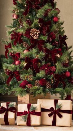 a christmas tree with presents under it