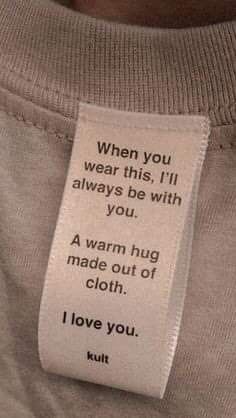 a person with a tag on their shirt that says, when you wear this i'll always be with you