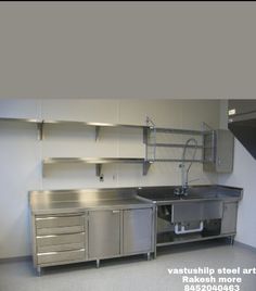 an industrial kitchen with stainless steel cabinets and sinks in the center is also built - in shelving