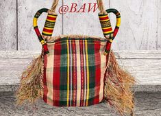 Bamenda Traditional Bags originated from our forefathers who wore them to traditional events and ceremonies. Today they are worn by both men and women to various event of their choosing. It complements the famous Toghu attires. Traditional Bucket Bag With Adjustable Strap, Traditional Shoulder Bag With Braided Handles, Traditional Rectangular Bag With Adjustable Strap, Traditional Bucket Shoulder Bag With Adjustable Strap, Traditional Rectangular Woven Bag, Traditional Rectangular Bucket Bag For Festivals, Traditional Bags With Adjustable Strap In Natural Color, Traditional Woven Bucket Bag For Market, Traditional Woven Bags For Market