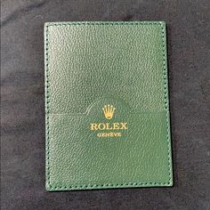 Green Leather Rolex Genve Card Holder Wallet With Signature Gold Crown Logo At Front - Rolex Card Holder - Green Leather - Unlined With Card Slots Measurements: (Approximate) Width: 3.5" Height: 4.75" Color: Green Condition: Nwot Designer Green Wallet With Interior Card Slots, Green Luxury Card Holder With Interior Slots, Designer Green Wallets With Interior Card Slots, Green Designer Wallets With Interior Card Slots, Luxury Green Wallets With Rfid Blocking, Luxury Green Wallet With Rfid Blocking, Green Leather Luxury Card Holder, Luxury Green Leather Card Holder, Green Bifold Wallet For Formal Occasions