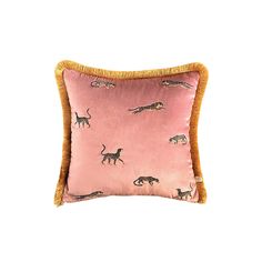 a pink pillow with leopards and giraffes on it