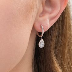 Elevate your dressy looks with these glamorous diamond drop earrings. Crafted in 14K white gold, each timeless earring features a pear-shaped diamond composite with a sparkling 1/5 ct. certified diamond boasting a color rank of I and clarity of I2. A frame of diamonds and milgrain detailing surrounds the dangle while additional diamonds shimmer along the hoop. Captivating with 3/4 ct. t.w. of diamonds and a bright polished shine, these earrings secure with latch backs. This style arrives with a certificate that include a photo and description of the diamonds, which guarantees quality and can be used for insurance purposes. Dimond Earrings, Simple Diamond Earrings, Simple Ring Design, Real Diamond Earrings, Gold Necklace Indian, Gold Necklace Indian Bridal Jewelry, Peoples Jewellers, Diamond Dangle Earrings, Diamond Earring