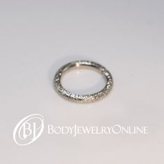 Please message us if you need help choosing a gauge or inside diameter! As a general rule, the thicker the gauge, the more noticeable the sparkle. LOOKING FOR A DIFFERENT GAUGE? Click here! WE LOVE THESE!!! This ring is made with a multistage, unique technique, resulting in tiny divots which catch and reflect the light Hypoallergenic Hoop Wedding Piercings, Hypoallergenic Hoop Piercings For Weddings, Silver Hoop Septum Ring For Anniversary, Hypoallergenic Adjustable Septum Ring For Weddings, Nickel-free Hoop Septum Ring For Wedding, Nickel-free Septum Ring For Wedding, Nickel Free Hoop Septum Ring For Wedding, Nickel-free Round Septum Ring For Wedding, Internally Threaded Silver Rings For Wedding