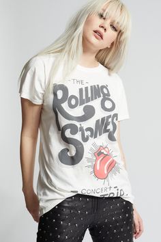 The Rolling Stones is a legendary band that has been making rock music and influencing pop culture since the early 1960s. This vintage style tee features authentic concert graphics with the band's iconic red lips and tongue logo. Made with soft cotton fabric, a ribbed crew neckline, short sleeves, and a classic t-shirt fit. Details Style #302510E Color: White The Rolling Stones Concert Bus Trip Unisex T-Shirt 100% Cotton Care/Import Machine Wash Cold, Tumble Dry Low Designed and Finished in Los Rolling Stones Tshirt, Rolling Stones Concert, Bus Trip, Travel Tees, Bus Travel, Fit Details, Red Lips, Rolling Stones, Rock Music