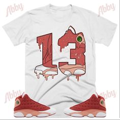 Custom Designed Sneaker T Shirt T-Shirt Features - Comfortable and light, premium short sleeve tee. 🔹 Premium fit 🔹100% Soft cotton 🔹Light fabric (4.3 oz/yd² (146 g/m 🔹Tear away label Shoes Not Included Custom Made - Not Adidas, Nike, or Jordan Brand Sneaker Tee, Sneaker T-Shirt The sneakers/shoes are not being sold in this product. You are only purchasing the tshirt/hoodie/socks/sweatshirt/tank top/hat/shorts. Shoes are NOT included. The shoes displayed are sold separately elsewhere and are only used for marketing purposes. We are displaying the shoes to help you visually find the best item to match your sneakers! 📦 Delivery: While we anticipate that you will receive your items within about a week, the delivery for this item can take up 10-14 Business Days. If unforeseen circumstance Red Graphic Tee With Sublimation Design, Red Short Sleeve Graphic Tee With Sublimation Design, Red Short Sleeve Sublimation Graphic Tee, Casual Red Sublimation Design For Streetwear, Red Casual Sublimation Design For Streetwear, 13 Shirt, Retro 13, Red Jordans, Sneaker Match Tees