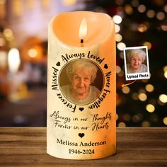 an old lady's memorial candle has been placed in front of a christmas tree