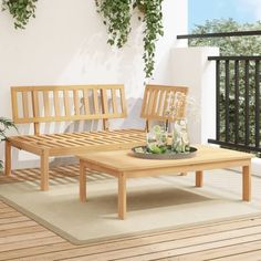 two wooden benches sitting next to each other on top of a wooden floor covered in plants