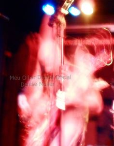 blurry photograph of a woman on stage