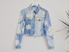 "AUNT GERTRUDE PRESENTS - reworked vintage denim jacket - cropped, frayed at the bottom - made of acid wash denim - embellished with gold, metal studs - materials: 100% cotton, metal studs CONDITION (1-10 ❶❷❸❹❺❻❼❽❾ Great condition SIZE/MEASUREMENTS size from label: no label best fist: Medium chest: 38,5 inches (98 cm) length: 18 inches (46 cm) sleeve length from armpit: 20 inches (51 cm) The model is 5'9\" (174 cm), measures 35-27-38 (90-69-96 cm) and wears size M" Casual Denim Jacket With Frayed Hem For Festivals, Distressed Denim Jacket For Festival, Trendy Medium Wash Denim Jacket For Festivals, Trendy Festival Denim Jacket In Medium Wash, Edgy Denim Jacket For Spring Festival, Edgy Spring Festival Denim Jacket, Acid Wash Denim Jacket For Summer, Distressed Grunge Denim Jacket For Festival, Summer Acid Wash Denim Jacket