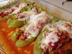 some green peppers covered in cheese and sauce