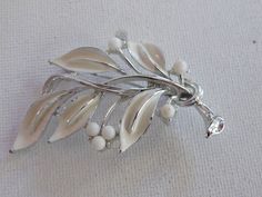 "Silver White bead Enamel Branch Leaves Brooch Pin Signed Lisner Good condition with some minimal wear to enamel 2 1/8\" by a little over 1 1/2\" I appreciate you taking the time to stop by my store. If I can be of any assistance, please let me know. For more beautiful vintage jewelry, click here: http://www.etsy.com/shop/meetingofthefinds. For US customers: If you would like this item insured, please convo me before purchase and I will add that cost in for you." Branch Leaves, Sioux City, Tiny Bird, Loop Earrings, Fall Gifts, I Appreciate You, Gold Crown, Pearl Brooch, Appreciate You