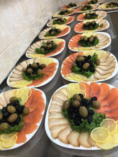 several plates filled with different types of food on top of a counter next to each other