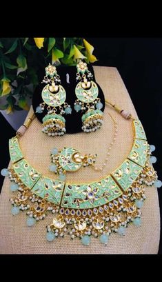 Occasion might be any, getting ready In a Sophisticated Manner Is Women'S Thing that they enjoy the most Mint Green Jadau Necklace Earrings Tika Set, Indian Kundan Jewelry Set, Statement Necklace Earrings Minakari Set, Bridal Necklace Earrings ITEM DESCRIPTION Metal = Gold Plated Occasion = Wedding ,Party Wear, Bridal Color = Green and White Size = Necklace Length = 8 Inches, Earrings/Studs Size = 3 Inches, Tika - 5 Inches 100% Satisfaction Guarantee: 1 Year Warranty, Long Lasting Plating, High- Round Green Meenakari Jewelry Set, Green Meenakari Jewelry Set, Green Dangle Bollywood Style Jewelry, Green Bollywood Style Dangle Jewelry, Green Dangle Jewelry For Diwali, Green Meenakari Dangle Jewelry, Green Meenakari Fusion Jewelry, Green Fusion Meenakari Jewelry, Green Jewelry With Matching Earrings For Festivals