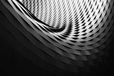 an abstract black and white photo with wavy lines