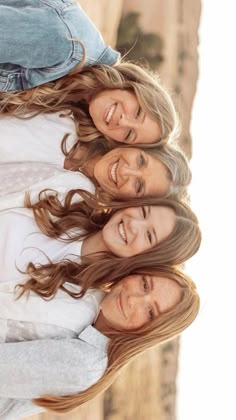 three women are smiling and posing for the camera