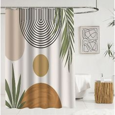 a shower curtain with an abstract design and palm leaves on the outside, in a bathroom