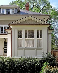 a large white house with two story windows