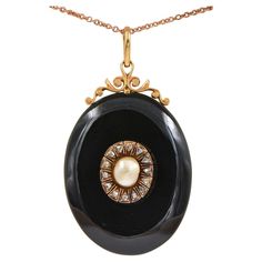 Memories Keeper Superb Victorian period 1880 ca, large carved Onyx locket pendant with scroll open work at the top side further embellished with centre – not nucleated Natural Sea Pearl – nestled into a halo of Rose cut Diamonds for a dramatic visual look Made of 18 Kt gold including the back window frame Onyx is skilfully hand carved, natural pearl is slight off shape but pretty large in size ( 8 x 6.6 mm.) outstanding in its individuality for goldish colour and unique shape prizing rare silky sheen and natural iridescence proper to natural pearls Rose cut Diamonds for approx .45 CT - by spread Window is foiled with Purple colour Silk , original glass , all in perfect order and kept in pristine condition Antique mourning jewellery is chic and fashionable easy wear on jeans or evening outf Black Locket, Victorian Period, Pearl Rose, Onyx Necklace, Sea Pearl, Water Pearls, Natural Pearl, Old Jewelry, Window Frame