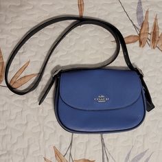 Refined Pebble Leather, Smooth Leather And Suede Inside Multifunction Pocket Snap Closure, Fabric Lining Outside Open Pocket Adjustable Shoulder Strap With 23" Drop For Shoulder Or Crossbody Wear 9 1/4" (L) X 6 1/2" (H) X 3" (W) Style No. Cb897 New Never Used No Tags Classic Blue Pouch Bag, Blue Crossbody Saddle Bag For Daily Use, Classic Blue Bag With Adjustable Strap, Blue Crossbody Saddle Bag With Detachable Strap, Daily Use Coach Saddle Bag With Adjustable Strap, Blue Crossbody Saddle Bag With Removable Pouch, Blue Rectangular Saddle Bag With Detachable Strap, Blue Crossbody Saddle Bag With Adjustable Strap, Blue Saddle Bag With Detachable Strap