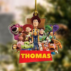 a christmas ornament featuring the characters of toy story