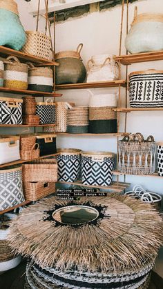 baskets and baskets are stacked on shelves in a room