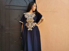 Beautiful moroccan navy blue kaftan for women with fine embroidery. This long dress is handmade in soft fabric cotton which is very pleasant to wear. Its shape and its length refine the silhouette. Moroccan dresses have the double advantage of being comfortable and stylish too. For example it is an ideal clothing for pregnant women.  This blue dress can be weared everywhere, indoor, outdoor... Or at a party/wedding with beautiful tuareg/berber jewelry and high heels : https://www.etsy.com/fr/shop/ChoukraneMarrakech?ref=seller-platform-mcnav&section_id=24615954.  This king of kaftan is without any doubt the most stylish design with butterfly sleeves.  This moroccan dress one size fit all body shape perfectly. This design can be weared with a belt if you want.  - Cotton ; - Fine embroidery - Elegant Blue Kaftan With Intricate Embroidery, Elegant Embroidered Blue Thobe, Elegant Embroidered Blue Kaftan, Floor-length Blue Kaftan With Resham Embroidery, Royal Blue Embroidered Kaftan, Moroccan Dress Kaftan Blue, Moroccan Dresses, Blue Kaftan, White Kaftan