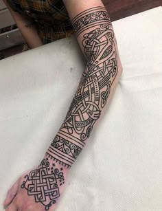 a person with a tattoo on their arm