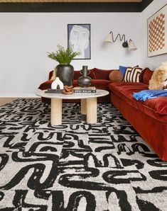 a living room with two couches and a coffee table in the middle of it