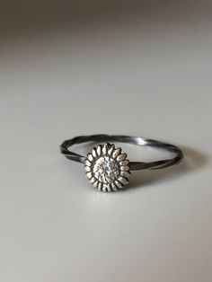 Welcome to Miss November Studio! I specialize in dainty feminine personalized jewelry for the discerning jewelry lover. This listing is for a single sterling silver sunflower stacking ring. All other rings are sold separately. Make a stack! Add a custom stamped band and two gemstone stacking rings with stones like black onyx and garnet. https://www.etsy.com/listing/150142799/set-of-3-rings-one-personalized-message Stacking rings are excellent accessories, not to mention fun to collect and wear. Handmade Stackable Rings For Everyday Wear, Everyday Handmade Stackable Rings, Dainty Sterling Silver Flower Jewelry, Dainty Flower-shaped Sterling Silver Jewelry, Sunflower Design Jewelry For Anniversary, Sunflower Design Flower Jewelry For Anniversary, Dainty Stackable Toe Flower Ring, Dainty Adjustable Stackable Flower Ring, Dainty Stackable Toe Ring