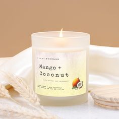 a white candle sitting on top of a table next to a piece of bread and some other items