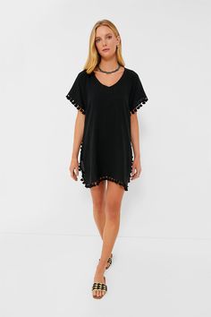 Easy, breezy and always ready for an adventure in the sun, the Katie Caftan is our go-to when picking a lightweight cover-up. Slightly sheer and detailed with pom-pom tassels, this V-neck dress is the perfect amount of chic and fun for an easy beach look. Just add your go-to suit and hat for a breezy, effortless feel– and don't forget the sunscreen! V-neckline Short sleeves Pom trim detailing Side slits Mini silhouette Slightly sheer Material: 100% Ramie Care: Wash separately in cold water Black Kaftan For Beach Cover-up In Spring, Black Kaftan For Spring Beach Cover-up, Black Spring Beach Cover-up Kaftan, Sleeveless Black Beachwear Cover-up, One Size Black Beach Cover-up, Sheer Material, Beach Look, Trim Detail, V Neck Dress