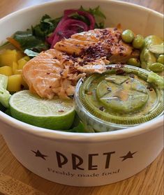 a white bowl filled with different types of food