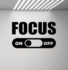 the focus on off sign is displayed in an empty room with light coming from above