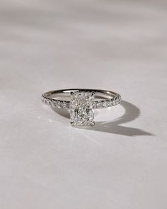 an engagement ring with a princess cut diamond