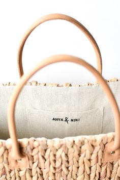 This extra large straw tote is woven from natural hyacinth and has two over-sized leather handles for carrying everything from beach gear to vintage finds. Neutral, classic and spacious, it can do it all. Content:- Hyacinth Straw - Leather- Linen Lining- Imported Size:- Width: 18.5" - Height: 11.25"- Depth: 9"- Handle Drop: 7.5" Straw Tote Bag, Beach Gear, Straw Tote, Tote Bag Leather, Leather Handles, Decorative Wicker Basket, Leather Handle, Vintage Finds, Leather Bag