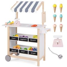 a toy ice cream stand with lots of scoops