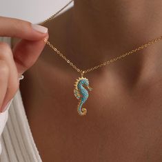 Welcome to the Magical World of PKJewelry Beach Jewelry Necklace Gold Plated Sea Horse Pave Necklace is perfect as a special gift for her. This Sea Horse necklace is a great choice as a gift for Mother's Day, Birthday, Anniversary, Valentines Day, Christmas. Our high quality products are specially prepared for you with great care. The gold plating on it is much thicker than other platings. Therefore, it is a nice gift to be used for a long time. Our products do not tarnish and are anti-allergic. - Our chains are sent with 16 inch and 2 inch extension chain. You can adjust it to the size you want. If you want it shorter or longer, please contact us.  All Our Animal Necklace  https://www.etsy.com/shop/PKJewelryNecklace?ref=shop-header-name&listing_id=1794870106&from_page=listing&search_query Sea Horse Necklace, Ocean Accessories, Seahorse Necklace, Pave Necklace, Beach Necklace, Animal Necklace, Special Gifts For Her, Horse Necklace, Beach Necklaces